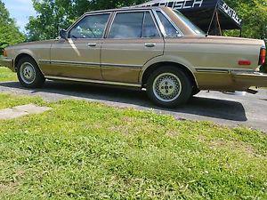  Toyota Cressida Gold and tan/beige on brown